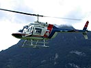 Bell 206B beim Versenken eines Kegels in einer 30 X 30 Dachluke. (Bild öffnet sich in einem neuen Fenster)
