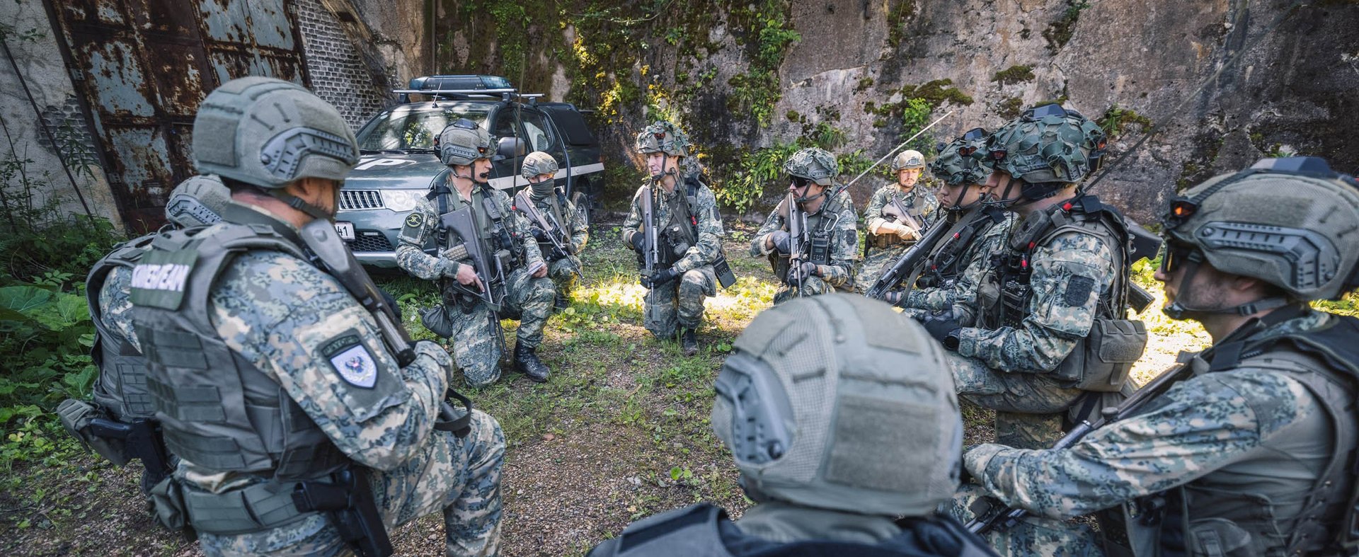 Soldiers recieve orders from their team leader.