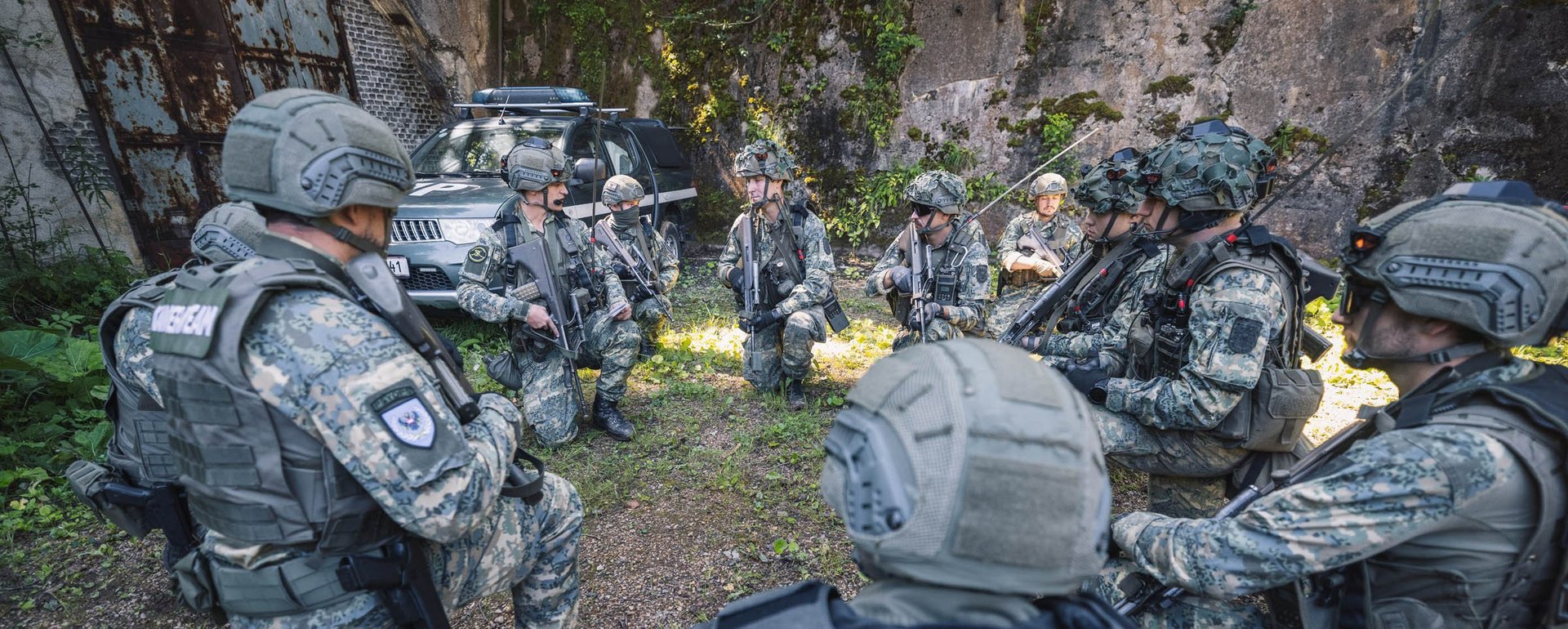 Soldiers recieve orders from their team leader.