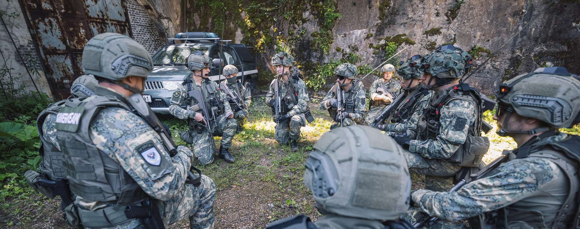 Soldiers recieve orders from their team leader.