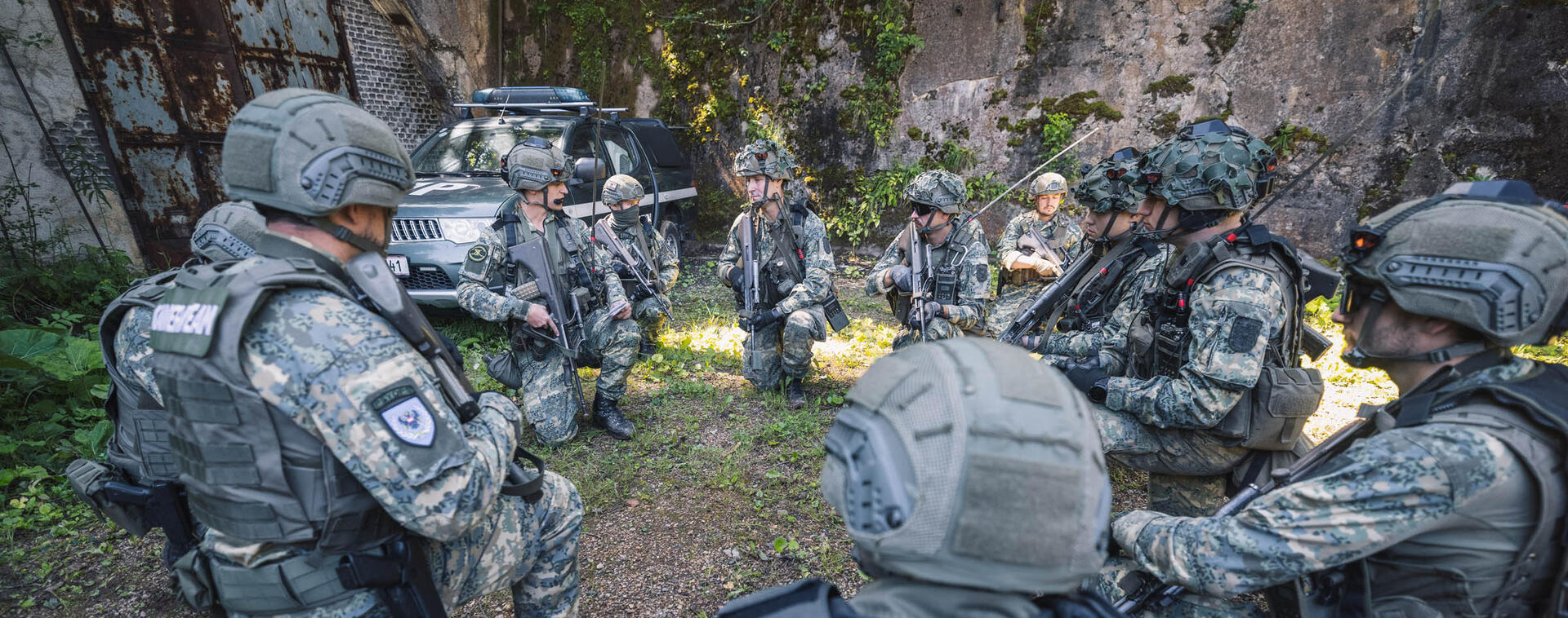 Soldiers recieve orders from their team leader.